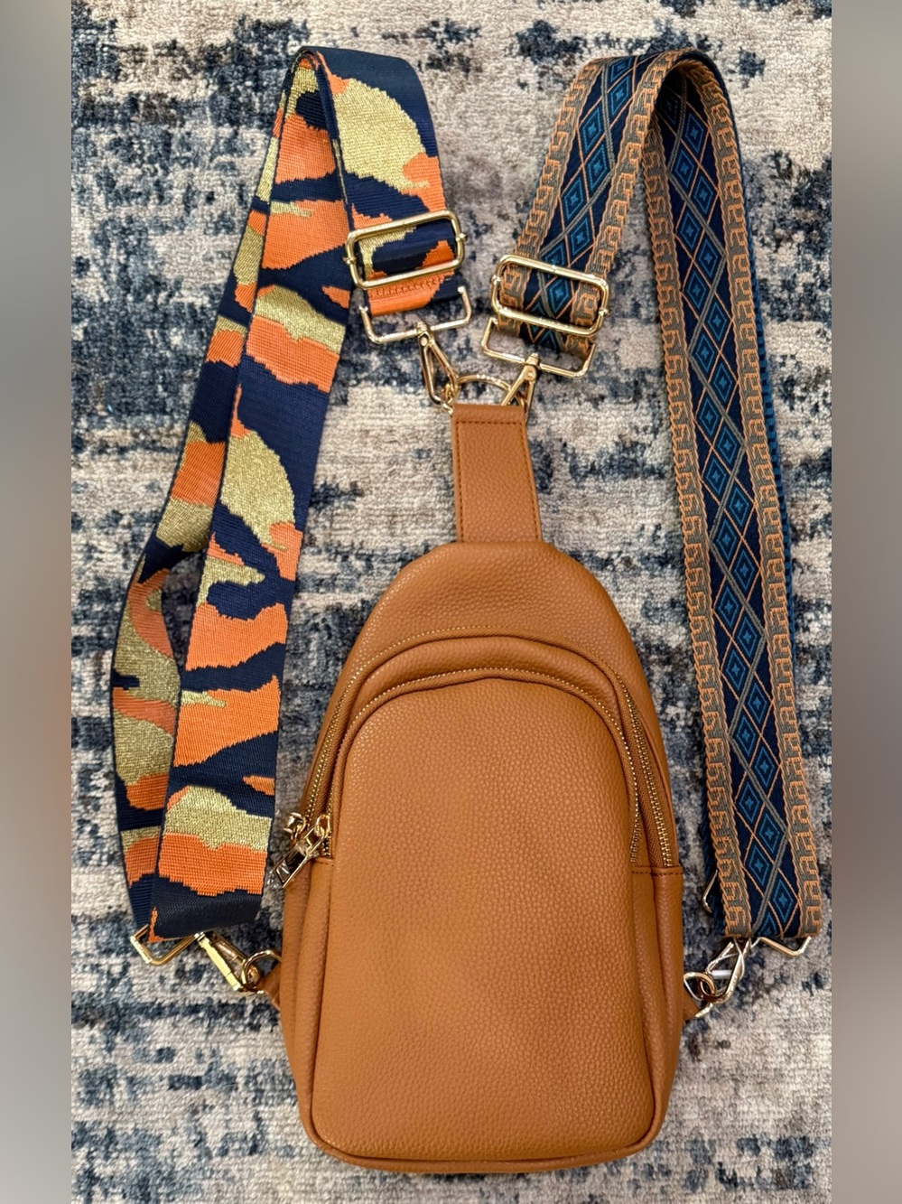 women's pebbled leather crossbody sling bag in a camel brown shade